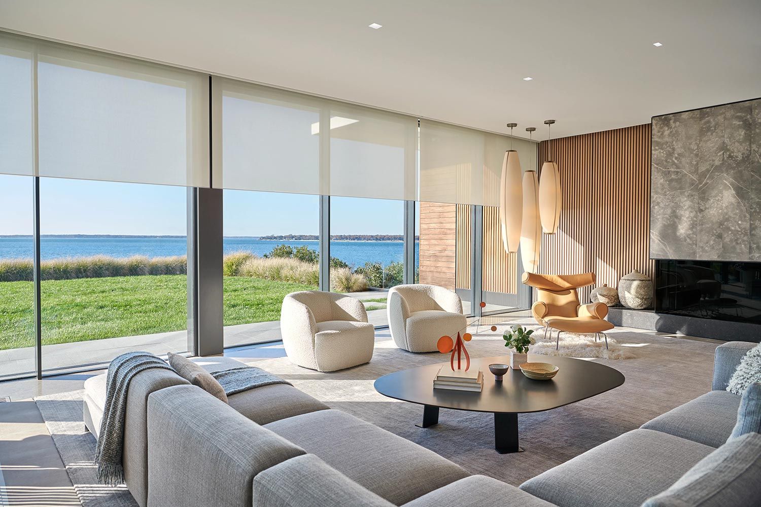 Bright modern living room with motorized window shades